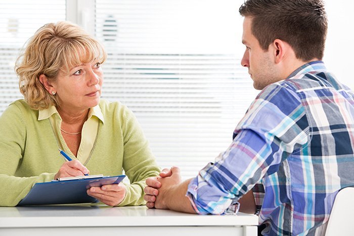 woman counsellor with male client
