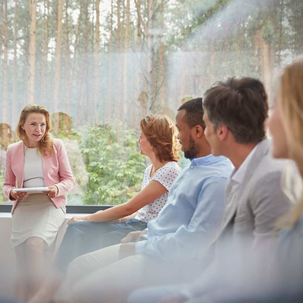 Group therapy session with people sitting together during an Intensive Outpatient Program