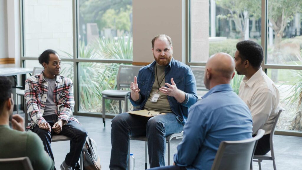 Professional explaining the levels of care for addiction treatment