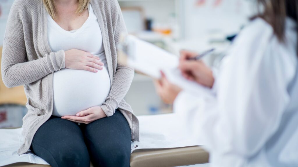 Dangers of Adderall who's at risk image of pregnant woman at doctor's visit
