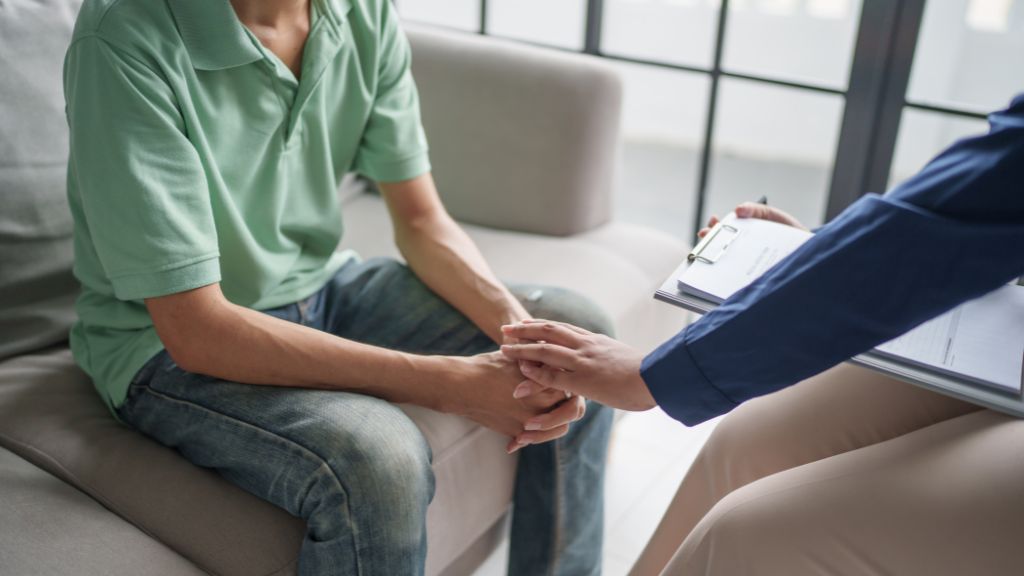 Clinician supporting a patient during a behavioral health consultation